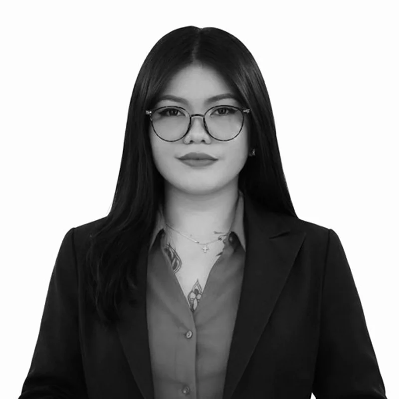 Professional woman wearing glasses and blazer